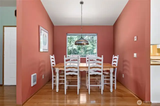 The charming dining area, with a large picture window.