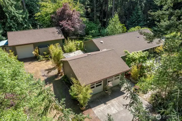 Birdseye view of the home, 2 car garage and the spacious attached studio and shop. This unique home has endless possibilites!