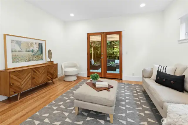 There are French doors to close off this room so it would make a nice private home office or media room. And there are also doors here leading straight out to the back deck and yard.