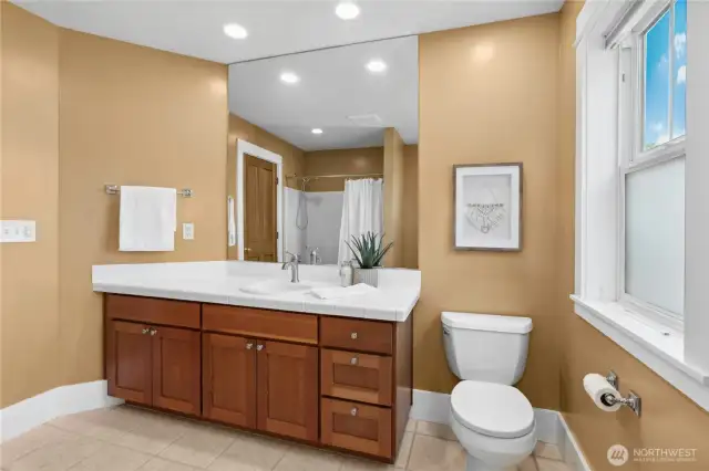 The main hallway bathroom upstairs with a tub and shower combo.