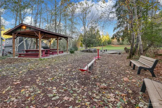 The open space, play park and covered picnic area in the neighborhood.