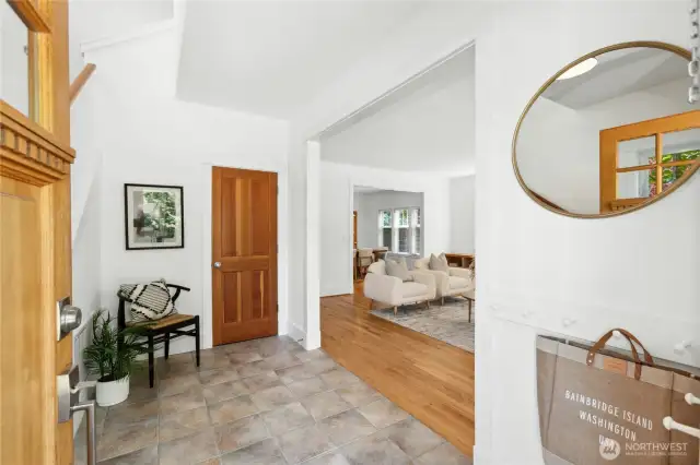 A gracious entryway has plenty of space to step in and kick off your shoes. There is large coat closet here too.
