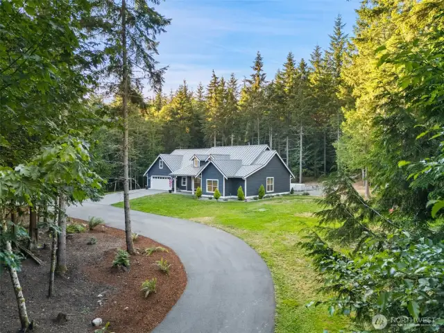 Private 9.46-acre PNW retreat just 25 mins from the Bainbridge Island ferry and minutes from the Kingston ferry! This 2019 custom 4BD/2.5BA home blends luxury and off-grid readiness with a whole-house generator, radiant in-floor heat, wood stove, and chef’s kitchen with granite counters. Spacious primary suite with ensuite and walk-in closets. Features include above-ground pool, in-ground trampoline, garden, greenhouse, chicken coop, and detached shop/garage—ideal for hobbies or home business. Gated entry, paved drive, walking trails, metal roof, and custom finishes. A must-see!