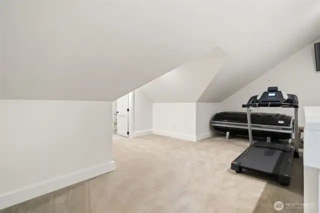 The upstairs offers a flex space for an office or workout room.