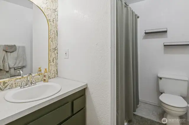 Well-lit full bath.