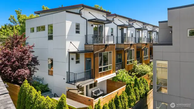 Notice two balconies off the kitchen and upstairs bedroom. Fenced Backyard with storage and separate access to lower level.