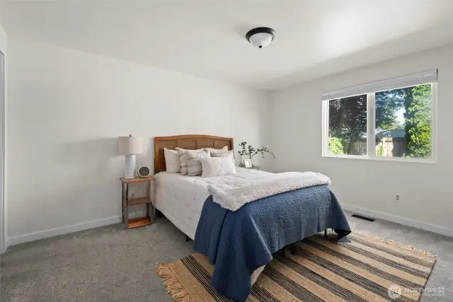 Huge main floor primary bedroom can easily accommodate a king size bed.