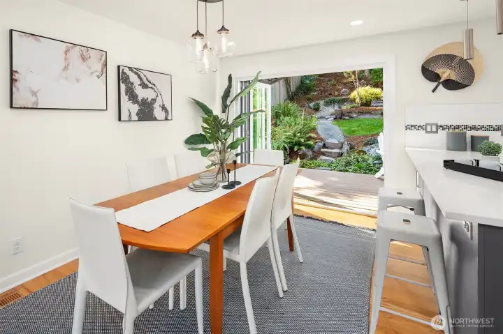 Dining room with bi-fold patio doors to the deck for indoor/outdoor living