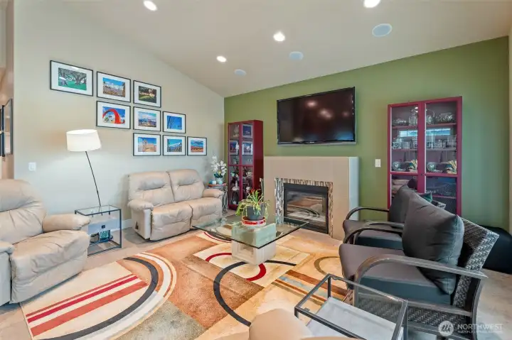 gas fireplace in living room; mounted TV stays with the home- surround sound too!