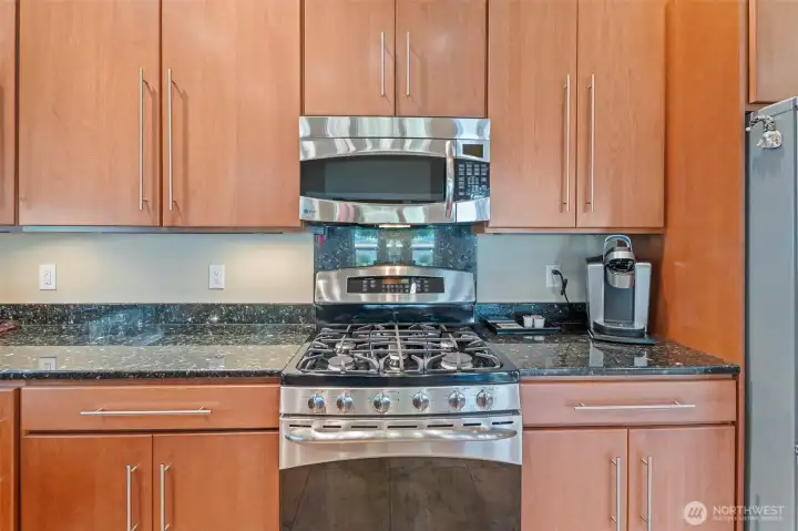 gas cooktop, electric oven- propane tank is owned and conveys to you- the buyer!
