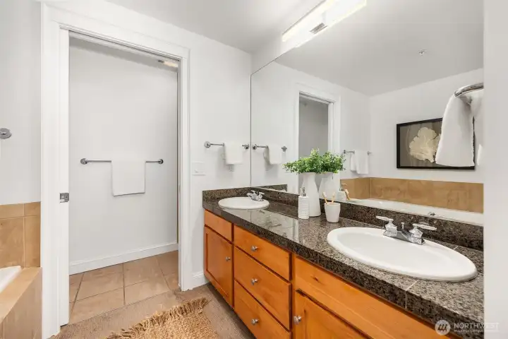 Primary bath with dual sinks, soaking tub and separate shower room.