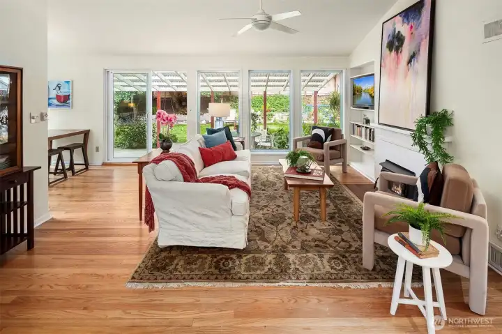 A wall of windows and vaulted ceilings in your bright living room welcomes you into this beautiful home!