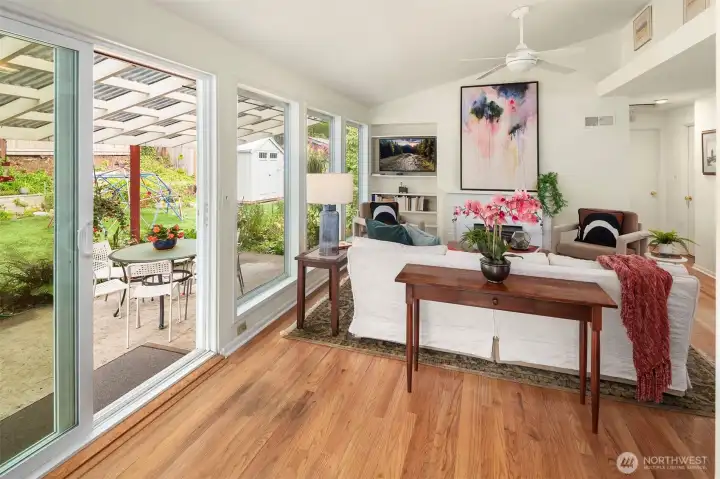 Wall of windows and slider doors to your large covered patio. What a wonderful space to entertain!