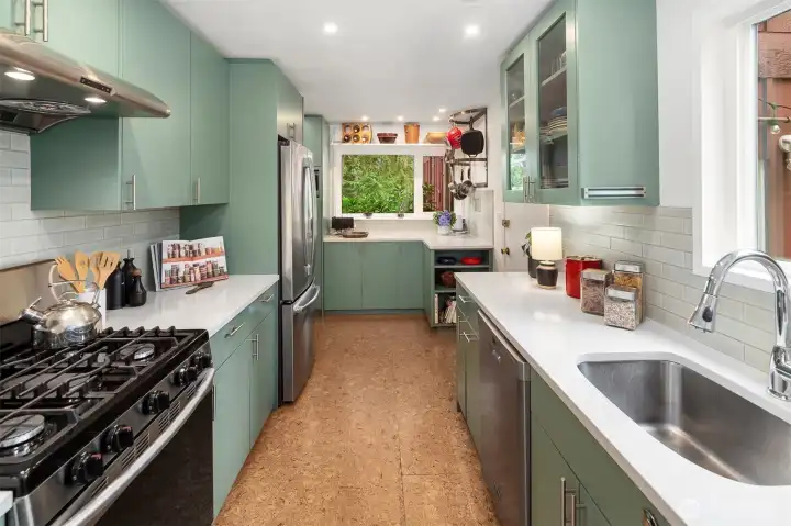 Looking into your kitchen from the dining room, there is so much space here! Note the lovely green views out the window here, too.