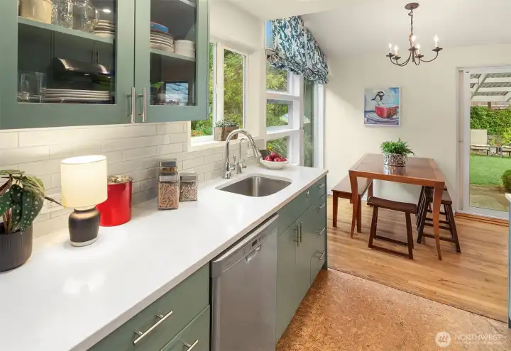 So much thought and care in the kitchen updates, from the serene color palette to the cork floors. Perfection!