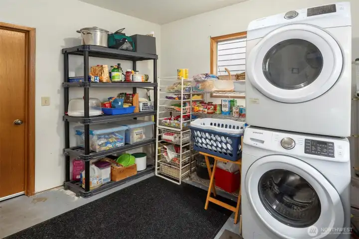 The large utility room offers great storage and conveniently sits between the attached garage, kitchen, and with a door out to your gorgeous yard.