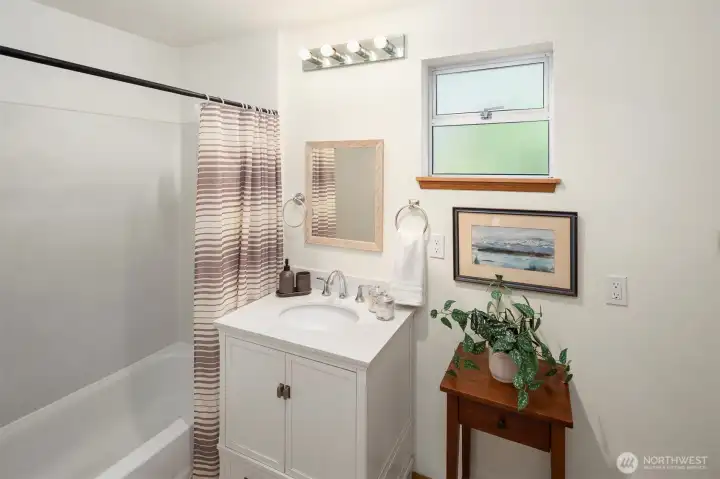 The full bathroom attached to the studio space.