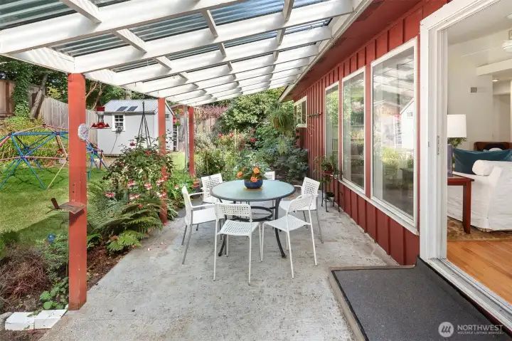 Another view of your covered patio. Such a sweet space to entertain or simply enjoy your sprawling backyard.