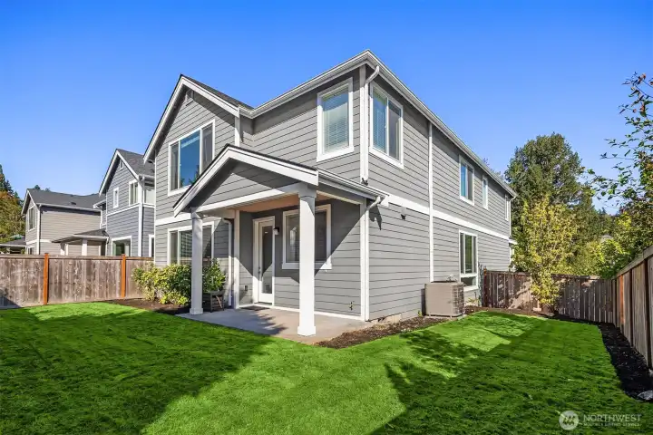 Backyard is fully fenced. Sod is new and not as green yet as this photo.