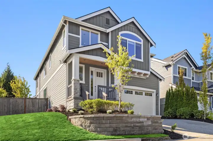 Perched high on the lot, the landscaping is all new.  Full sprinkler system with timer for easy maintenence.