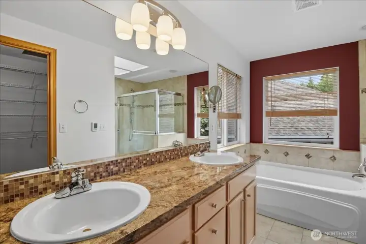 The primary en-suite has a double vanity and heated floors.