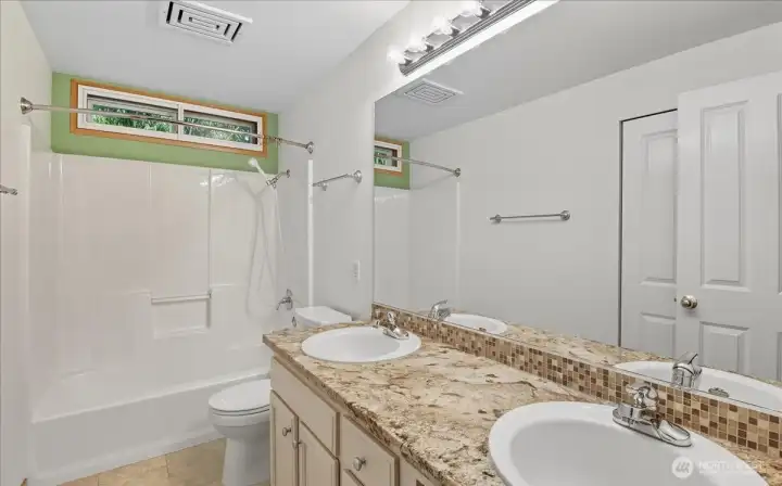 This is the main bath on the second floor.  It has a double vanity for plenty of counter and storage space.