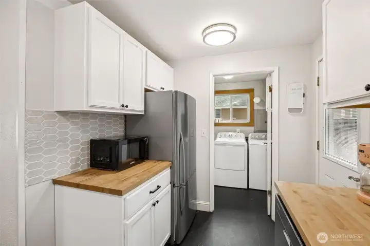 Fully renovated kitchen connected to laundry room