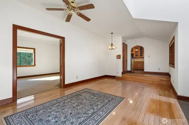 Family room leads to the living room on the left and the kitchen up the steps