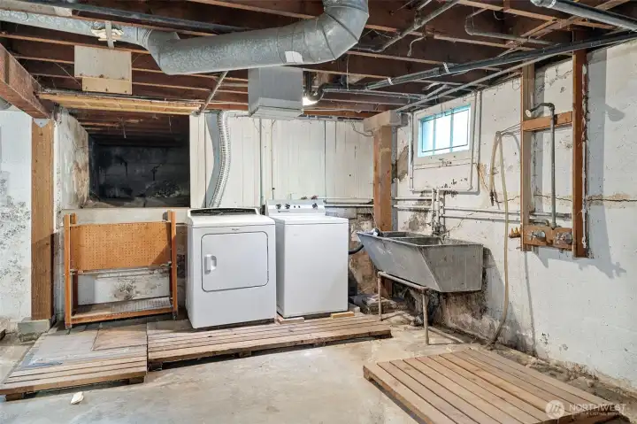 Unfinished basement with laundry