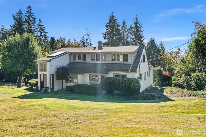 Rolling lawn surrounds the house