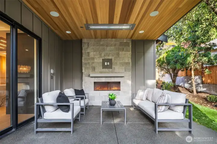 Outdoor covered living area with fireplace