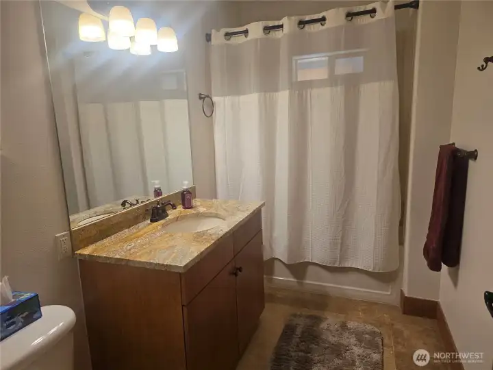 Guest bathroom with tub/shower combination