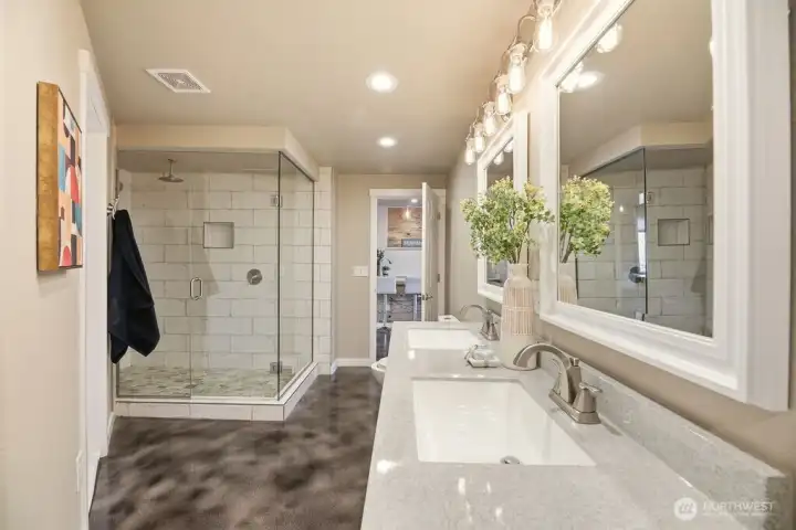 Basement bath with lots of storage a shower big enough for 2. And double sinks.