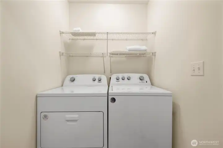 Full laundry area across from the powder room.