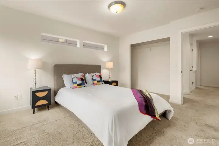 Primary suite is full of natural light.