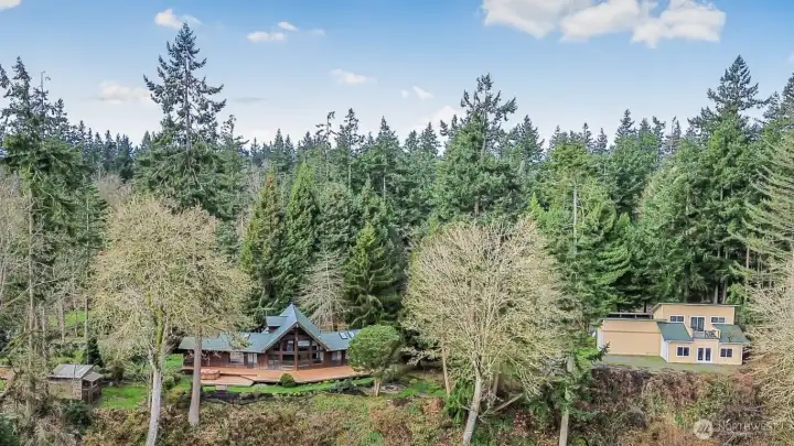Home and shop on 5+ acres of tranquil south-end waterfront, on Camano Island.