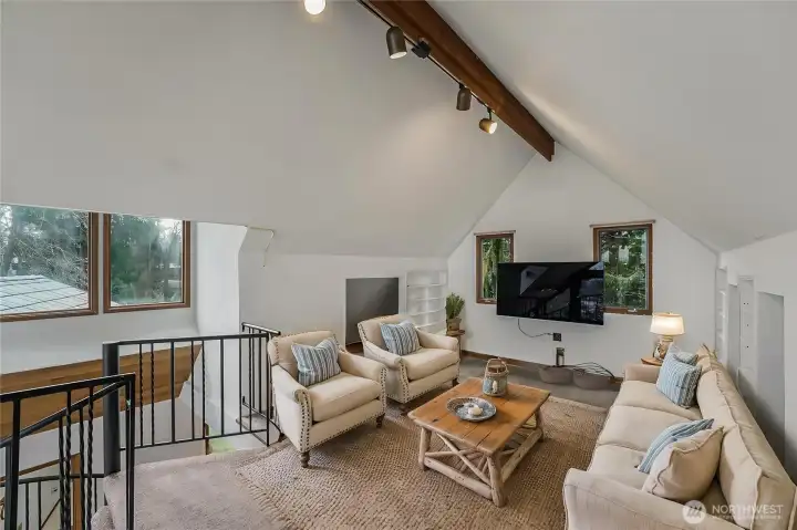 They virtually staged loft as a bonus living room.