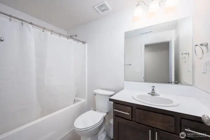 Large Full Shared Bath w/ ceramic tile.