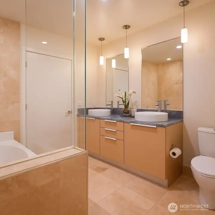 Unwind in the spa-inspired 5-piece bath with soaking tub & dual vanities