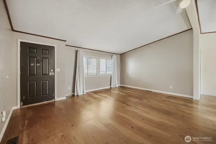 Bright and open living room with natural light and easy flow—perfect for relaxing or entertaining.