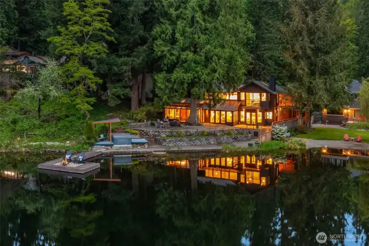 Nestled on the golden shores of Ames Lake, this exceptional waterfront property offers a rare opportunity to experience serene lakeside living.