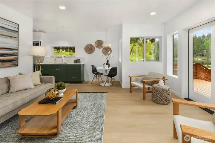 Main level flexible living space with its own kitchen, bath, bedroom, private entrance, and laundry—ideal for multigenerational living or guest quarters.