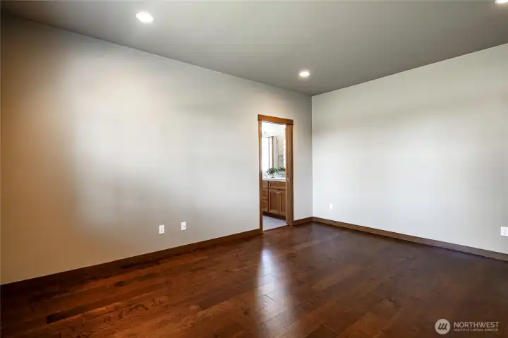 Primary bedroom with attached bathroom. Primary bedroom with attached bathroom.