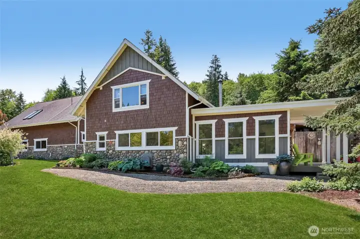 Rear exterior showcases the property's park-like setting