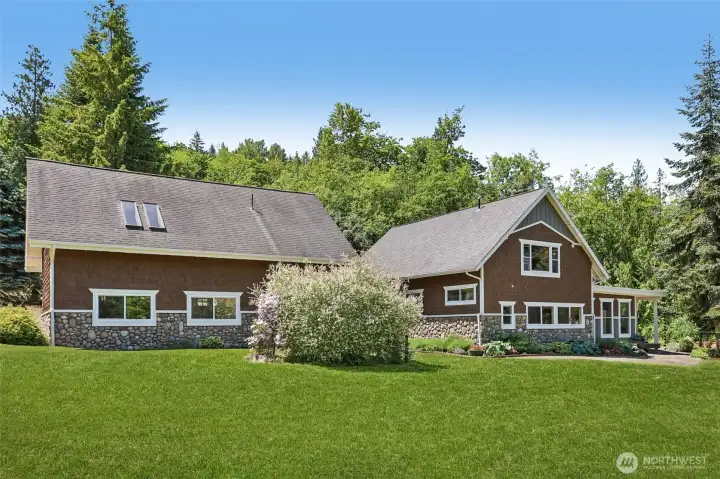 Rear Large windows throughout the home bring in natural light.