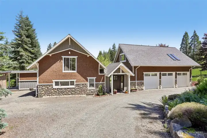 The impressive front exterior showcases the seamless integration of the original home with a thoughtfully constructed addition.