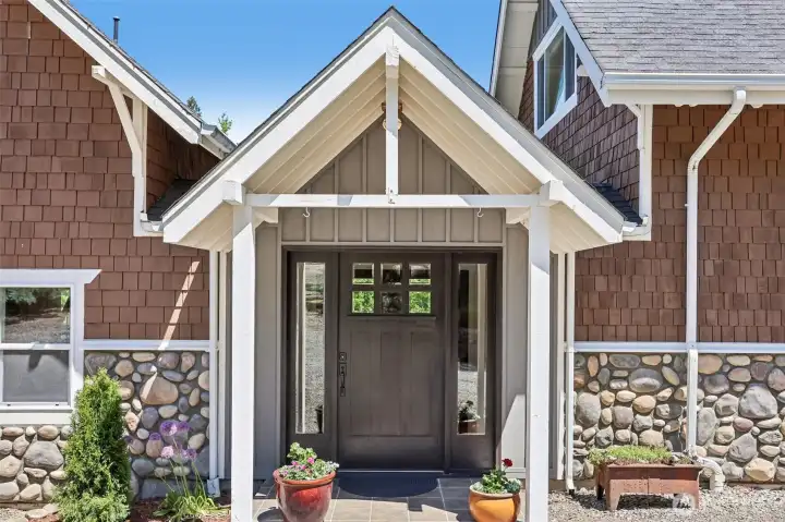 A covered front porch and custom entry welcome you home to this beautifully updated and expanded Fall City estate.