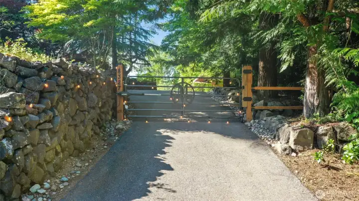 Electric gate (w app control feature) provides security and a welcome to visitors with the custom symbol.