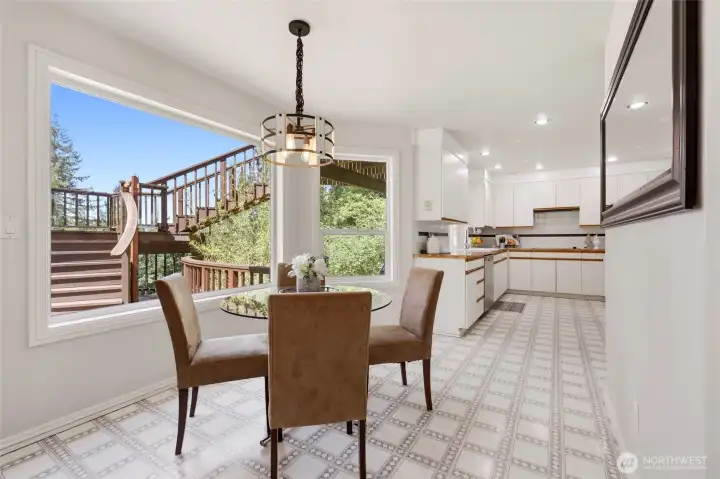 The stylish fixture over the kitchen nook complements the curved staircase on the deck outside... such quality and care in the details!