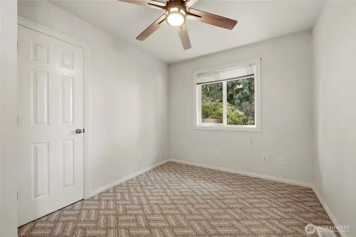 Also on the mail floor is this flex room with ceiling fan and closet--guest room, office, play area, school room, or hobby space--all good options!